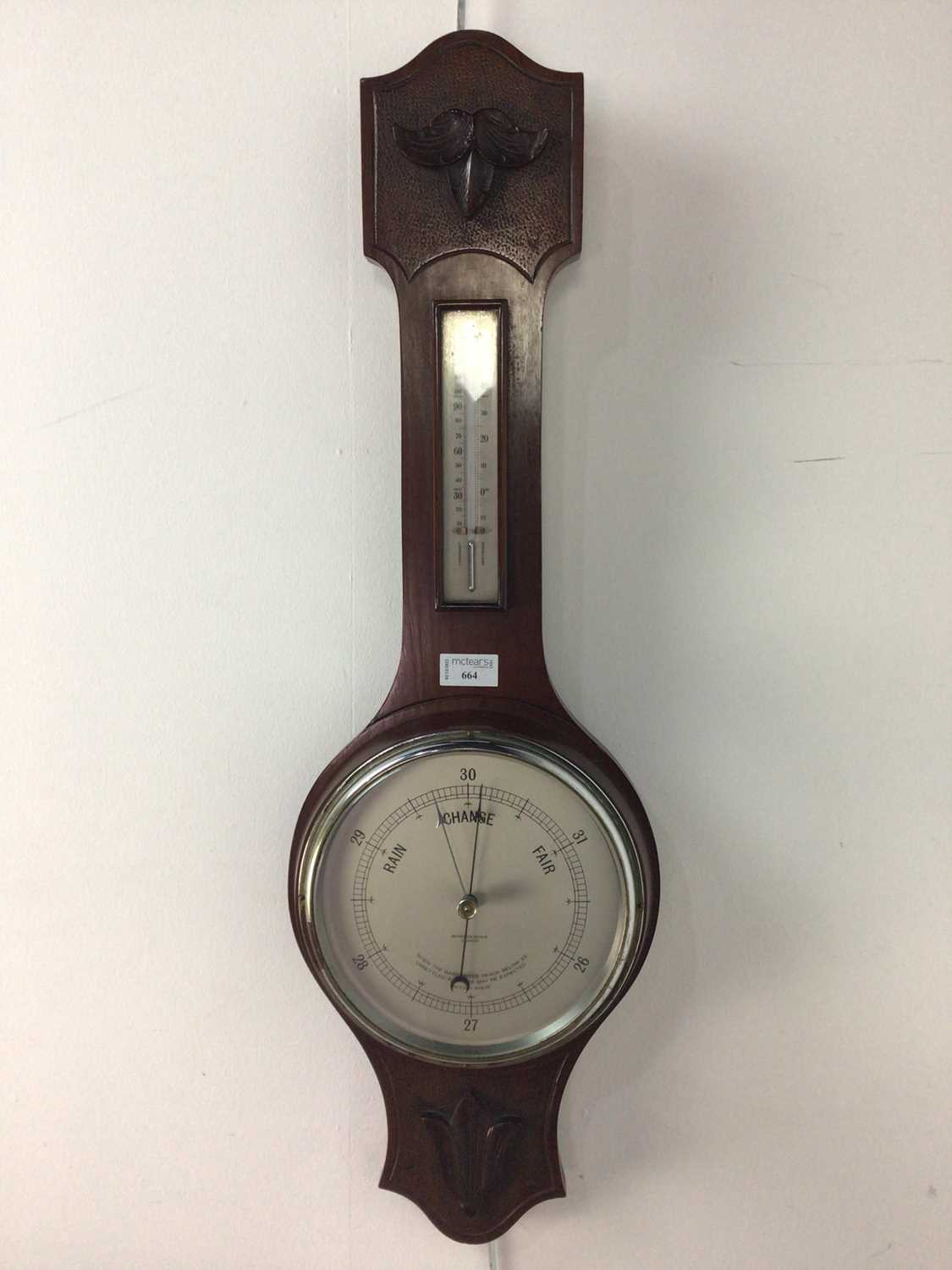 A WHEEL BAROMETER WITH THERMOMETER