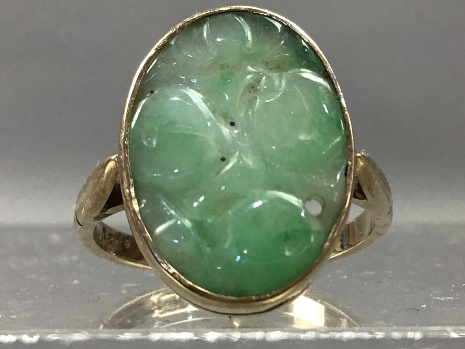 A CARVED JADE RING