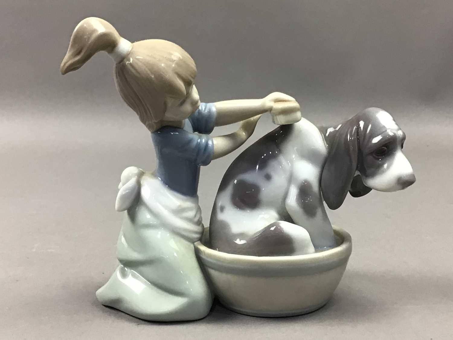A LLADRO FIGURE OF A GIRL WASHING A DOG AND OTHER FIGURES