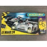 FOUR SCALEXTRIC SETS INCLUDING LE-MONO 24