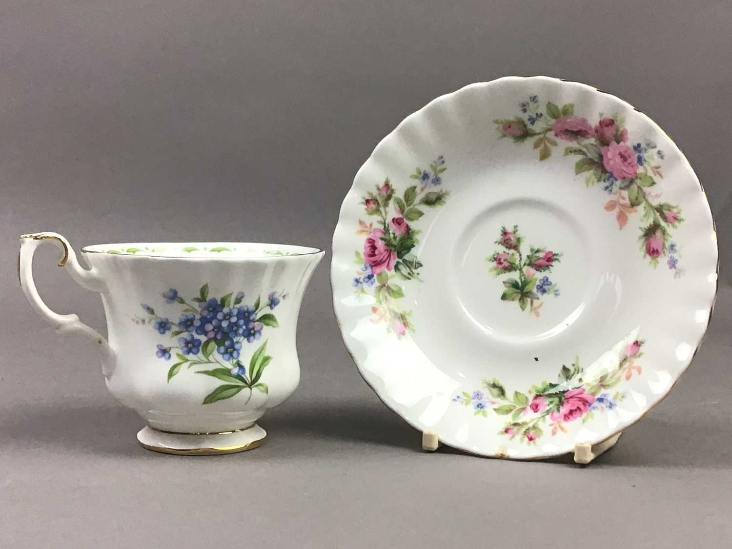 A ROYAL ALBERT MOSS ROSE TEA SERVICE AND FORGET-ME-NOT CUPS AND SAUCERS