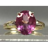 A PINK TOPAZ AND DIAMOND RING