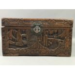 A SMALL CHINESE CARVED CAMPHORWOOD CHEST