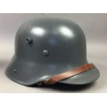 A REPRODUCTION M16 STAHLHELM AND TWO CAPS