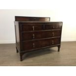 AN OAK CHEST OF DRAWERS