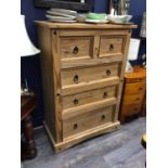 A MODERN PINE UPRIGHT CHEST OF DRAWERS