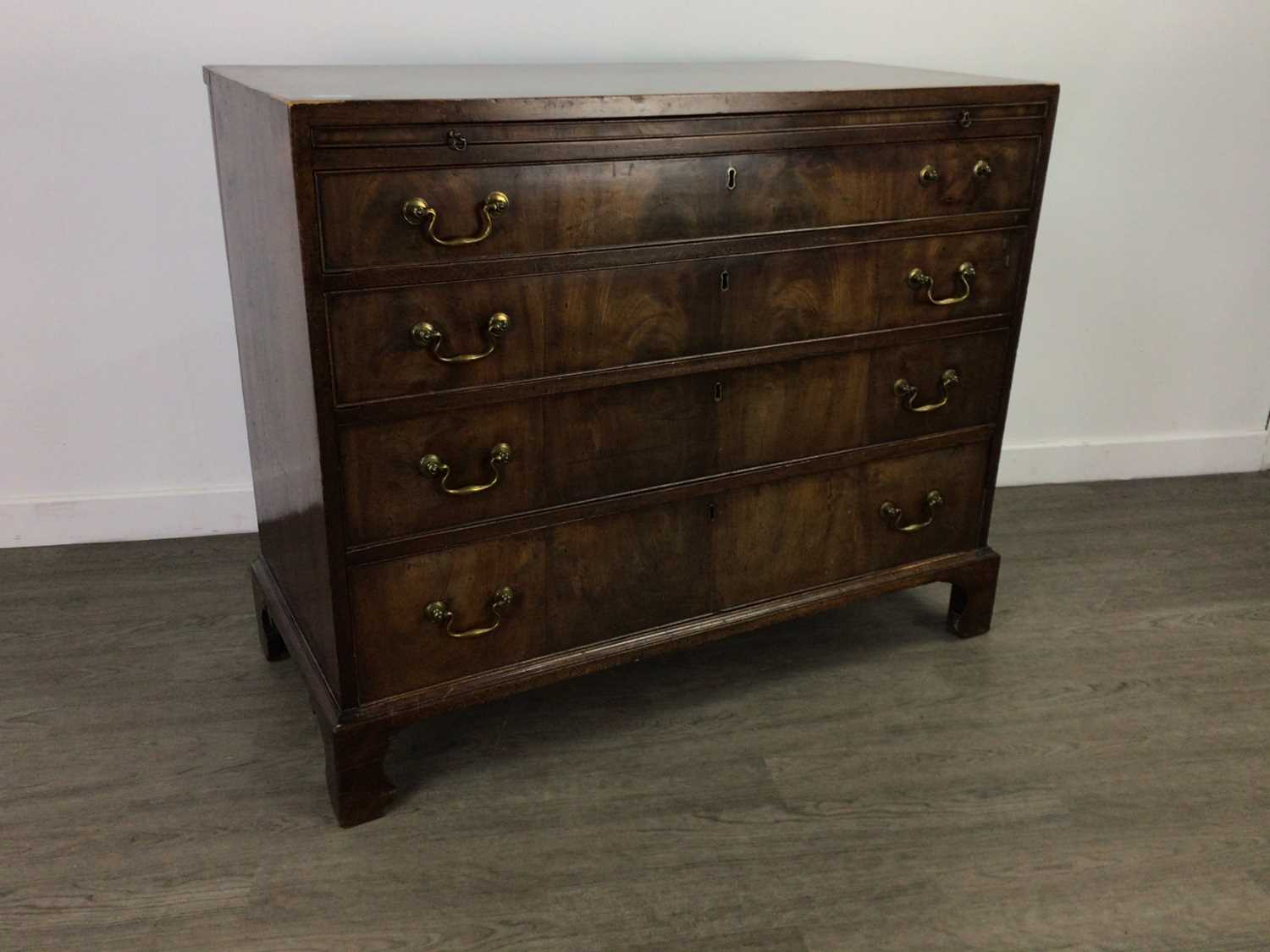 A 19TH CENTURY MAHOGANY CHEST OF FOUR DRAWERS