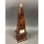 A TREEN DESK TOP OBELISK AND PUZZLE