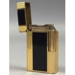 A GOLD PLATED AND ENAMEL CIGARETTE LIGHTER BY S. T. DUPONT
