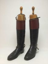 A PAIR OF VINTAGE LEATHER RIDING BOOTS WITH SHOE TREES