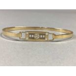 A GOLD RENNIE MACKINTOSH STYLE BANGLE