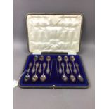 A SET OF TWELVE SILVER TEASPOONS AND TONGS