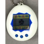 AN ORIGINAL TAMAGOTCHI ELECTRONIC TOY AND OTHERS