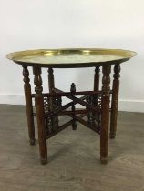 AN EARLY 20TH CENTURY INDIAN BRASS TRAY TOPPED TABLE
