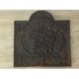 A 17TH CENTURY CAST IRON FIRE PLACE BACK PLATE