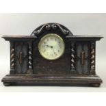 AN EARLY 20TH CENTURY OAK MANTEL CLOCK