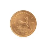 A GOLD KRUGERRAND DATED 1975