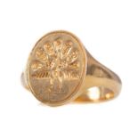 A GOLD SIGNET RING