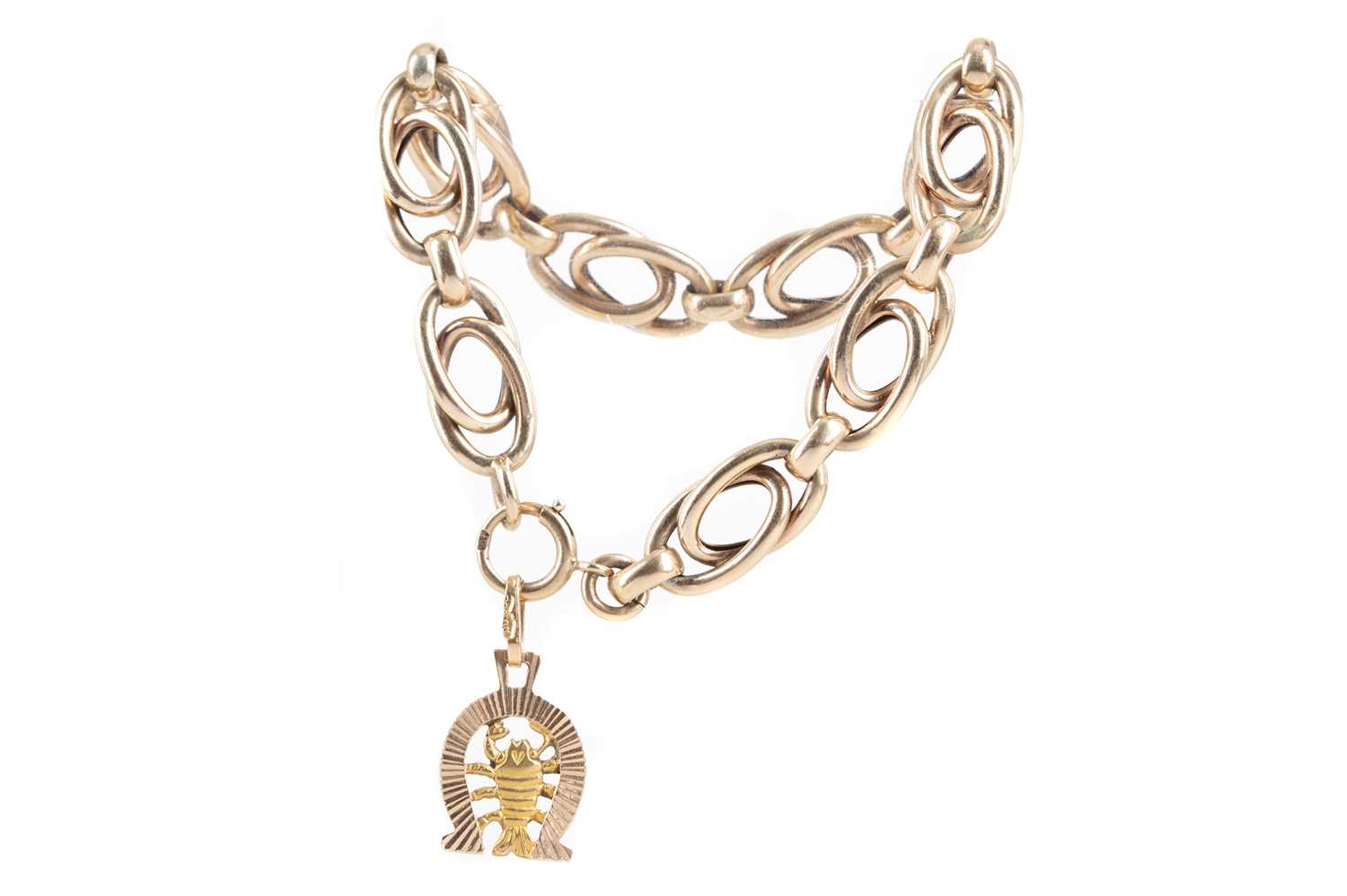 A GOLD BRACELET WITH SCORPION CHARM