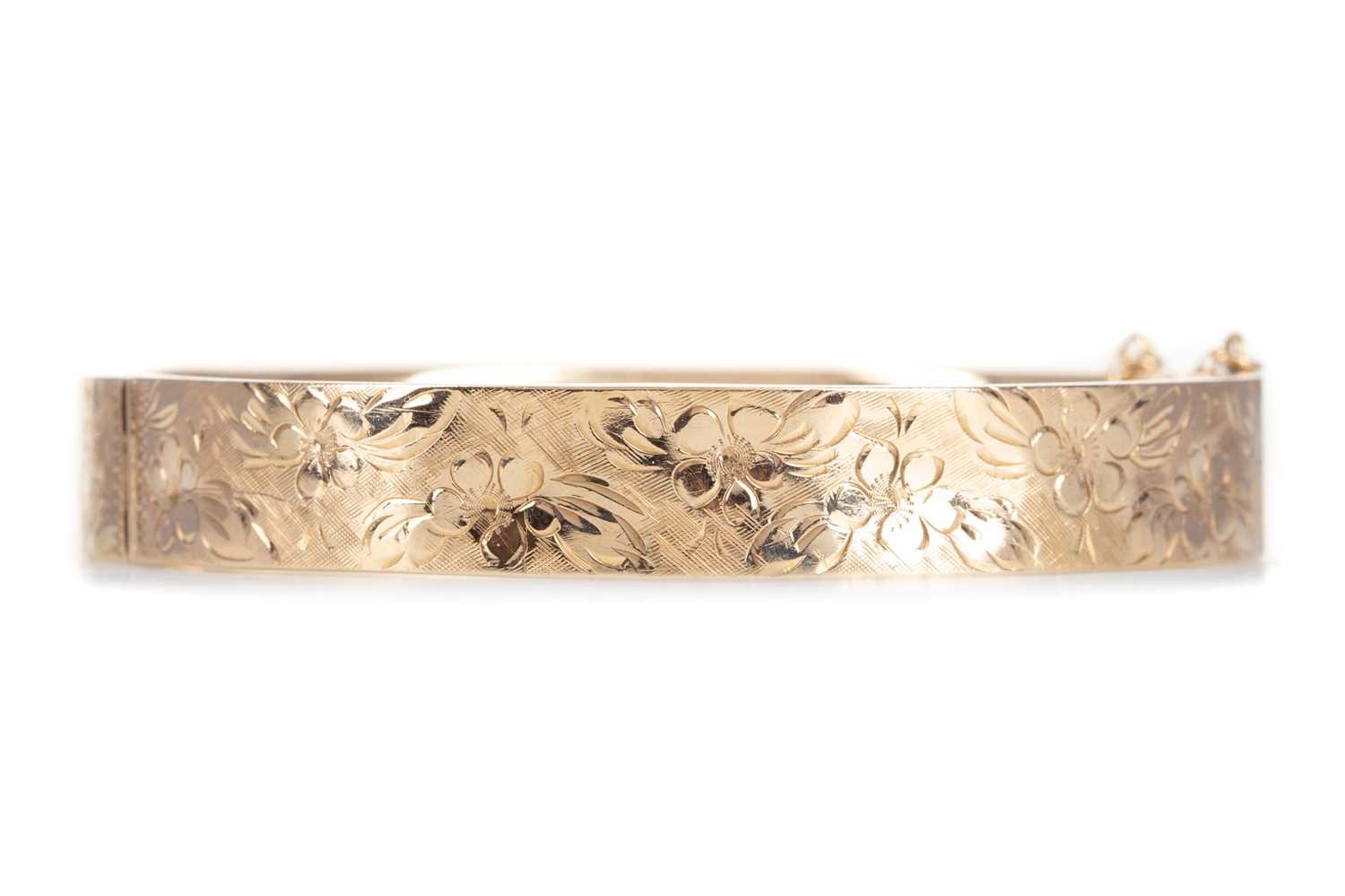 A NINE CARAT GOLD BANGLE