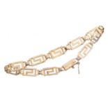 A NINE CARAT GOLD GREEK KEY PATTERN BRACELET