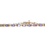 A TANZANITE AND DIAMOND BRACELET