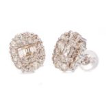 A PAIR OF DIAMOND CLUSTER EARRINGS