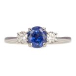 A SAPPHIRE AND DIAMOND RING