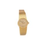 A LADY'S OMEGA EIGHTEEN CARAT GOLD MANUAL WIND WRIST WATCH