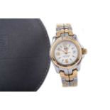 A LADY'S TAG HEUER PROFESSIONAL STAINLESS STEEL QUARTZ WRIST WATCH