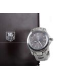 A GENTLEMAN'S TAG HEUER LINK TIGER WOODS STAINLESS STEEL AUTOMATIC WRIST WATCH