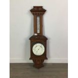 A LATE VICTORIAN OAK CASED ANEROID BAROMETER AND THERMOMETER