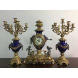 A REPRODUCTION 'IMPERIAL' CLOCK GARNITURE