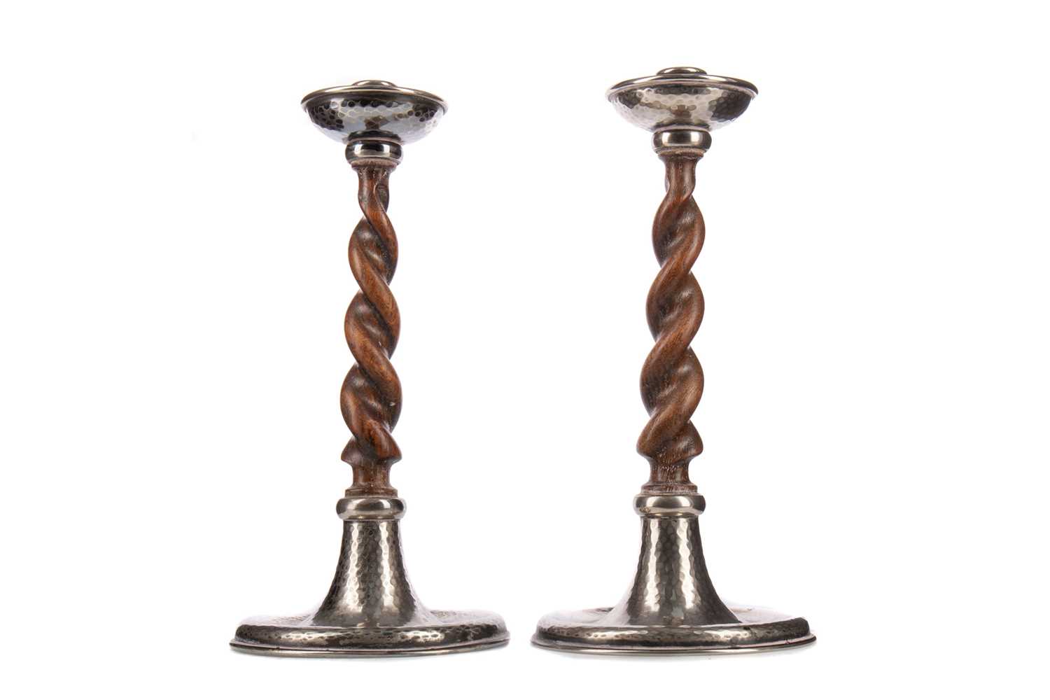 A PAIR OF ARTS & CRAFTS OAK SPIRAL TURNED CANDLESTICKS