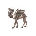 A WHITE METAL MODEL OF A CAMEL