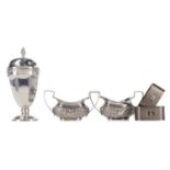 A GEORGE V SILVER SUGAR CASTER, ALONG WITH A PAIR OF OPEN SALTS AND NAPKIN RINGS