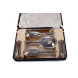 A GEORGE V SILVER MOUNTED DRESSING TABLE SET