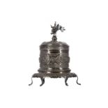 AN EARLY 20TH CENTURY BURMESE SILVER TEA CADDY ON STAND