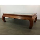 A CHINESE WINDOW FRAME SET INTO A LOW ELM TABLE