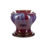 A CHINESE SANG DE BOEUF GLAZED VASE