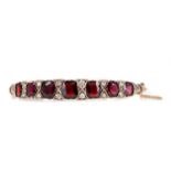 A GARNET AND DIAMOND BANGLE