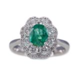 AN EMERALD AND DIAMOND RING