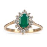 AN EMERALD AND GEM SET RING