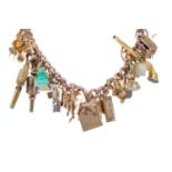 AN IMPRESSIVE GOLD CHARM BRACELET