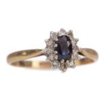 A SAPPHIRE AND DIAMOND CLUSTER RING