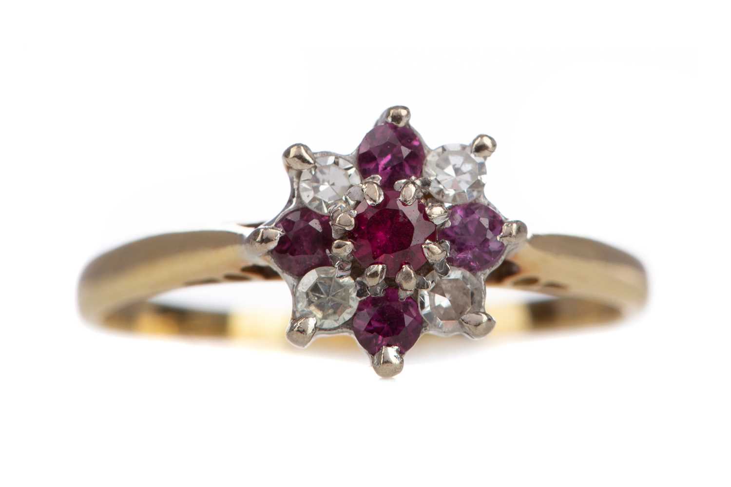 A RUBY AND DIAMOND CLUSTER RING