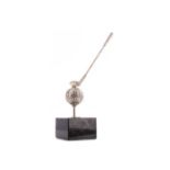 GOLFING INTEREST - A WHITE METAL AND MARBLE DESK WEIGHT