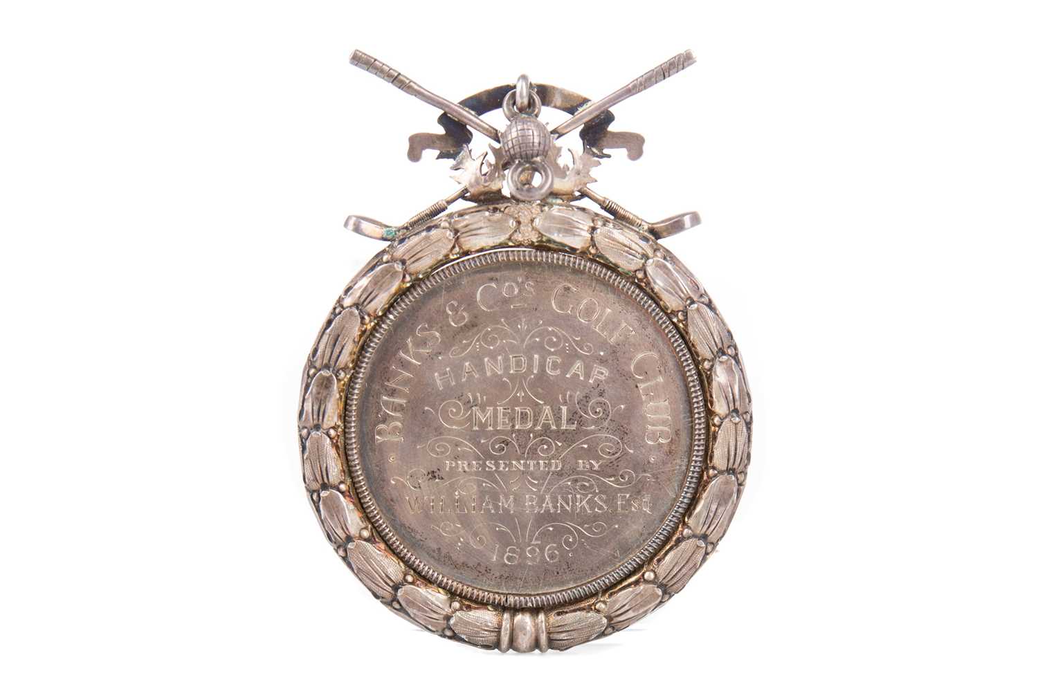 A VICTORIAN SILVER BANKS & CO'S GOLF CLUB HANDICAP MEDAL