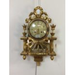 A 20TH CENTURY GILT WALL CLOCK OF FRENCH DESIGN