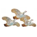A GRADUATED SET OF THREE BESWICK FLYING PARTRIDGE WALL PLAQUES